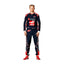 Nico Hülkenberg standing confidently in his 2023 Austin Grand Prix racing suit, featuring a deep navy blue base adorned with red accents and subtle star patterns
