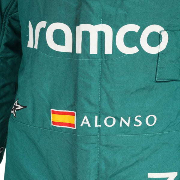Close-up of the fabric and stitching on Fernando Alonso’s 2023 F1 racing suit, capturing the high-quality material and detailed sponsor branding, designed for durability and race-ready functionality.