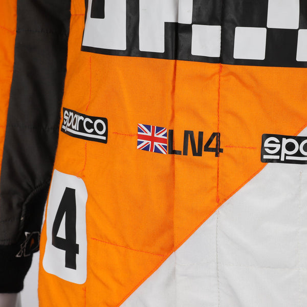 Close-up of the special edition Spanish GP racing suit showcasing premium fabric texture and subtle commemorative graphics.