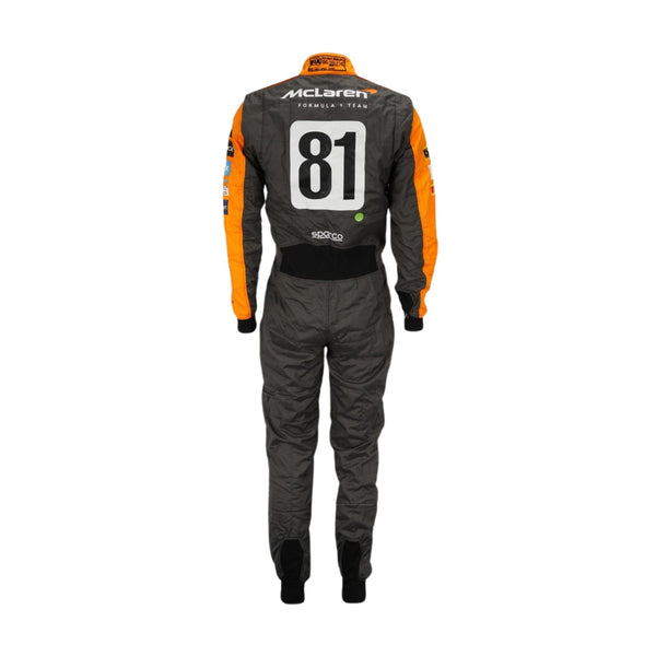 Rear view of Piastri's 2023 F1 racing suit from the Spanish Grand Prix, showcasing his name and race number with commemorative crown graphics.