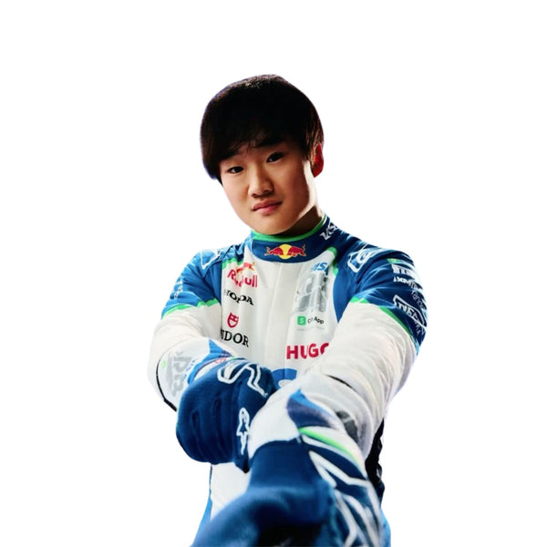 Close-up of Yuki Tsunoda's 2025 F1 race suit, displaying the intricate white fabric with blue and green accents and detailed sponsor logos.
